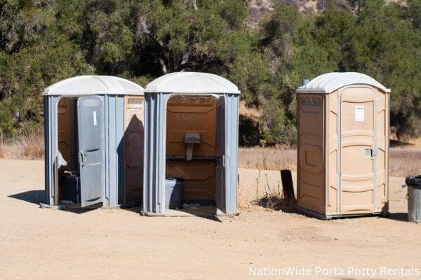 a clean row of portable restrooms for outdoor weddings or festivals in Creston, CA